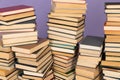 stack of books on a purple background science education culture training