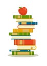 Stack of books with red apple