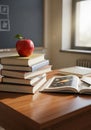 Stack of Books with Red Apple on a Wooden Desk in a Classroom Royalty Free Stock Photo