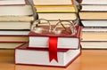 A stack of books with a red ribbon Royalty Free Stock Photo