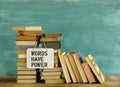 Stack of books and saying Words have power, education reading,learning concept