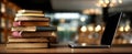 The stack of books beside a sleek laptop in a cozy workspace..AI generated image Royalty Free Stock Photo