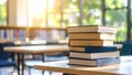 Stack of books on a table in a bright library with blurred background Royalty Free Stock Photo