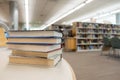 Stack of books on table at library Royalty Free Stock Photo