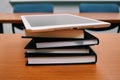 Stack of books and tablet on the table. Royalty Free Stock Photo