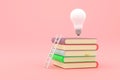 Stack of books with white ladder and illuminated light bulb on top of them Royalty Free Stock Photo