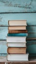 Stack of books on wooden board background