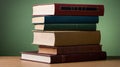 Stack of books on a wooden table against a green gradient background, evoking knowledge and learning Royalty Free Stock Photo