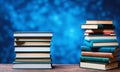 stack of books on the wooden table on blue background, copy space Royalty Free Stock Photo