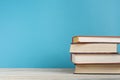 Stack of colorful books on the wooden table. Education background. Back to school. Copy space for text. Royalty Free Stock Photo