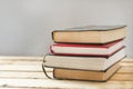 A stack of books on a wooden table. Royalty Free Stock Photo