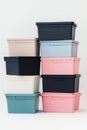 A stack of boxes with different colors, including pink, blue, and black. The boxes are arranged in a pyramid shape, with the pink Royalty Free Stock Photo