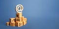 Stack of boxes and email internet symbol. Online Internet distribution of goods. E-commerce. Network marketing advertising. Remote