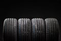 Stack of brand new high performance car tires Royalty Free Stock Photo