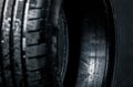 Stack of brand new high performance car tires Royalty Free Stock Photo