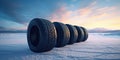 Stack of brand new tires against the backdrop of a beautiful winter landscape at dawn, concept of Blur