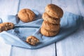 Stack of bread buns on blue towel. Home-baked bread