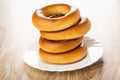 Stack of bread rings baranka in plate  on wooden table Royalty Free Stock Photo