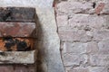 Stack of bricks next to partially removed wall plaster - background Royalty Free Stock Photo