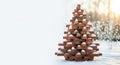 Stack of bricks in shape of Christmas tree, background with copy space. Greeting card or New Year banner for construction comapny Royalty Free Stock Photo