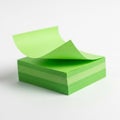 Stack of Bright Green Sticky Notes with One Page Curled Up on White Background notepad Royalty Free Stock Photo