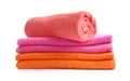 Stack of bright towels on white background