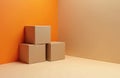Stack of brown cardboard boxes in room corner. Minimalist studio shot of parcels against orange wall. Courier package delivery Royalty Free Stock Photo
