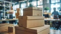 Stack of brown cardboard boxes on table in modern office space. Close-up of packaging in start-up environment. Shipping Royalty Free Stock Photo