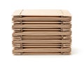Stack of brown cardboard boxes on white background Royalty Free Stock Photo