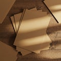 A stack of brown craft paper rests on a wooden surface with a rustic texture. The pap Royalty Free Stock Photo