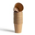 A stack of brown disposable paper cups is shown, neatly arranged vertically. One cup is slightly Royalty Free Stock Photo