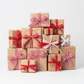 Stack of brown gift boxes with red ribbons and bows Royalty Free Stock Photo