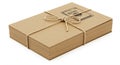 A stack of brown kraft paper, shaped into a large, rectangular bundle, is tied together Royalty Free Stock Photo