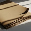 A stack of brown kraft paper sheets, lightly textured, is shown with a curled corner on Royalty Free Stock Photo