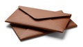 Stack of brown leather envelopes isolated on white background Royalty Free Stock Photo
