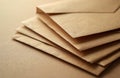 Stack of brown paper envelopes for mail. Blank kraft paper pieces ready for correspondence. Recycled material for letters and Royalty Free Stock Photo