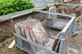 A stack of brown slate stones inside a container at a construction site Royalty Free Stock Photo