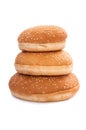 Stack of burger buns with sesame seeds on white background Royalty Free Stock Photo