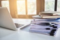 Stack of business report paper file on modern white office desk Royalty Free Stock Photo