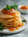 Stack of Buttermilk Pancakes with Apricot Jam and Fresh Fruit on Rustic Table Royalty Free Stock Photo
