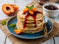 Stack of Buttermilk Pancakes with Apricot Jam and Fresh Fruit on Rustic Table Royalty Free Stock Photo
