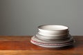 a stack of canned goods with a small empty plate