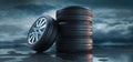 Stack of car wheels and tires in the rain Royalty Free Stock Photo