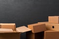 Stack of cardboard boxes against black background Royalty Free Stock Photo