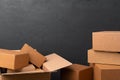 Stack of cardboard boxes against black background Royalty Free Stock Photo