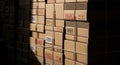 Stack of Cardboard Boxes with Fragile Labels in Warehouse Lighting packaging shipping Royalty Free Stock Photo