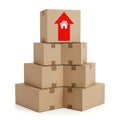 Stack of cardboard boxes with a house symbol on top symbolizing relocation or moving Royalty Free Stock Photo