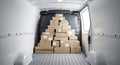 Stack of cardboard boxes inside a delivery van ready for shipping and transportation Royalty Free Stock Photo