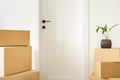 Stack cardboard boxes in living room Moving into new house concept Royalty Free Stock Photo