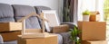 Stack of cardboard boxes in living room at new house Royalty Free Stock Photo